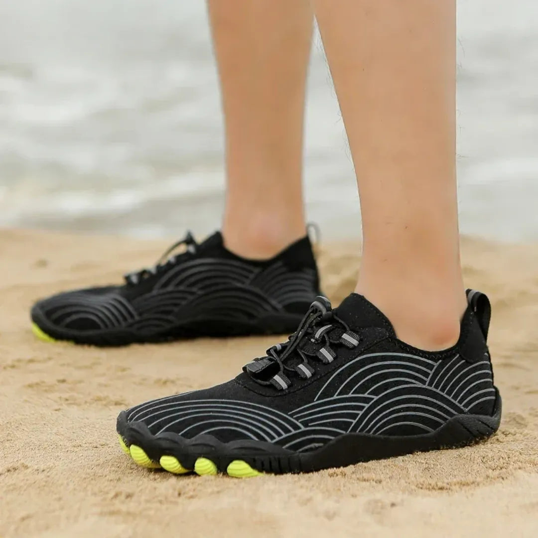 AquaFreedom Water Grip barefoot water shoes in action - beach lifestyle and water sports-black